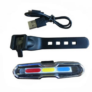 USB rechargeable bicycle tail light displayed with its charging cable and adjustable black mounting strap.