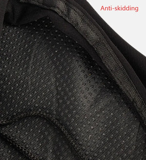 Close-up view of non-slip textured fabric backing on a black bicycle saddle cover with red text 'Anti-skidding'