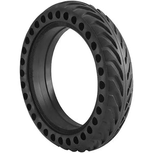 Black 8.5-inch solid airless tire for electric scooter with honeycomb shock-absorbing holes on a white background