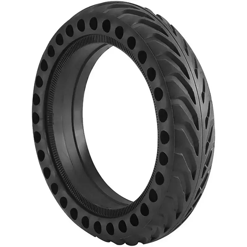 Black 8.5-inch solid airless tire for electric scooter with honeycomb shock-absorbing holes on a white background