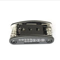 Folded black and silver 16-in-1 bicycle repair multi-tool with numbered function labels on a white background