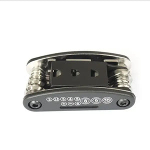 Folded black and silver 16-in-1 bicycle repair multi-tool with numbered function labels on a white background