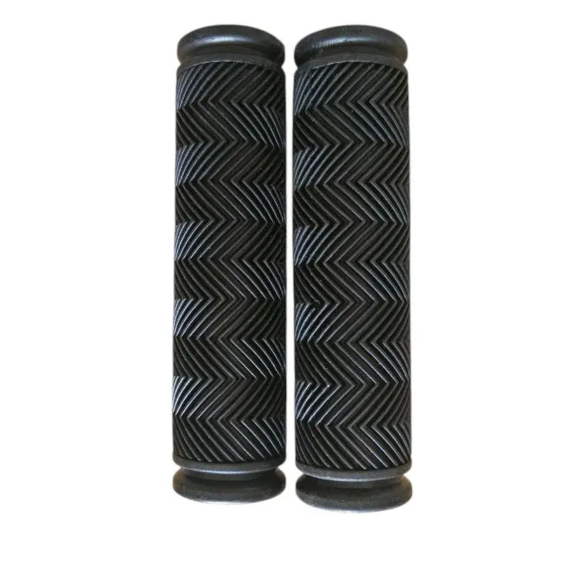 Horizontal view of a single black bicycle handlebar grip with a textured chevron pattern