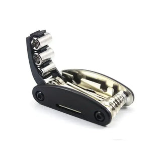 Unfolded black 16-in-1 bicycle multi-tool displaying hex keys, screwdrivers, and socket wrenches on a white background