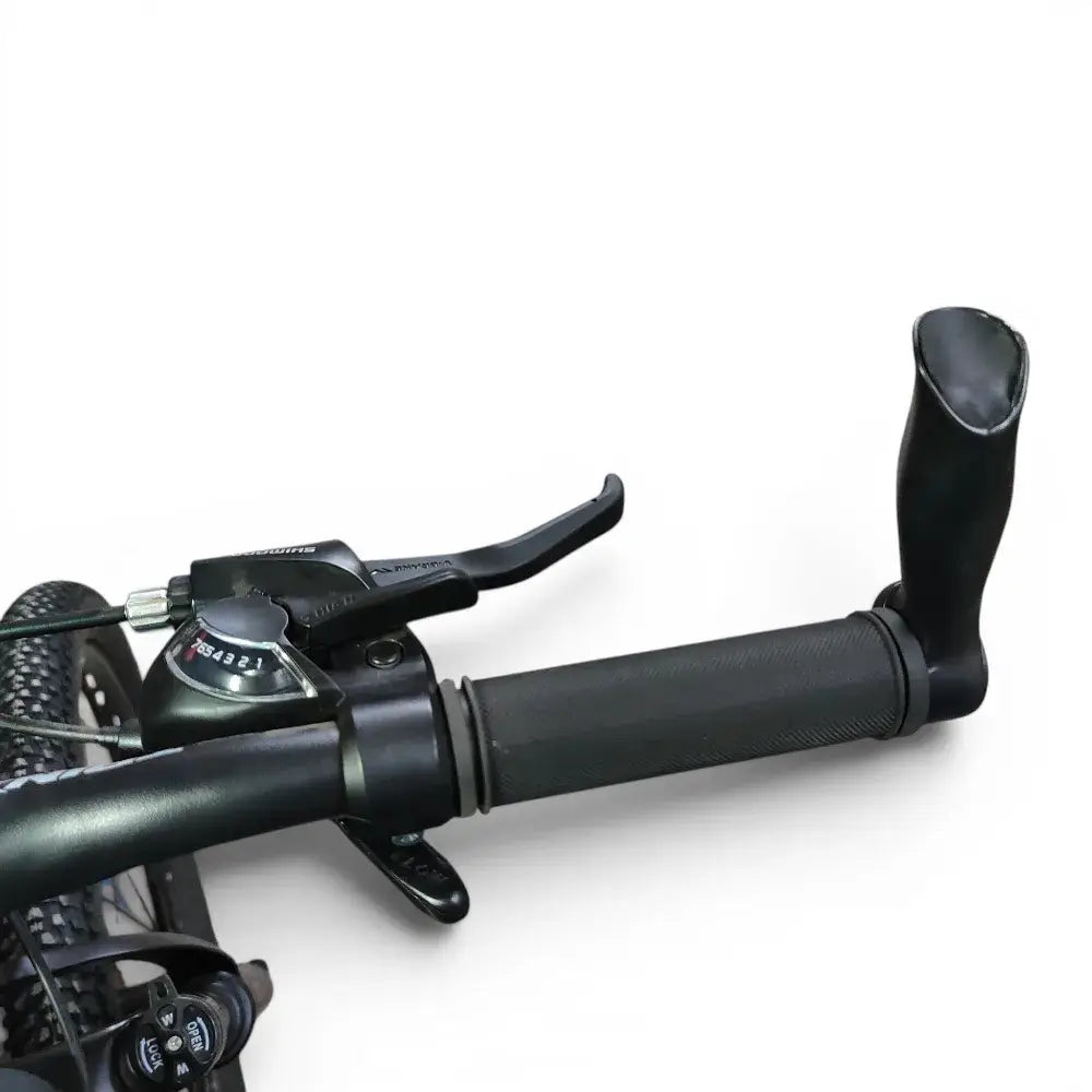 Detailed view of Trinx K024 mountain bike handlebar grip featuring ergonomic bar end horns, brake lever, and Shimano shifter