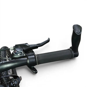 Detailed view of Trinx K024 mountain bike handlebar grip featuring ergonomic bar end horns, brake lever, and Shimano shifter