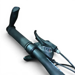 Close-up view of Trinx K024 mountain bike handlebar grip featuring ergonomic bar end horns, Shimano 3-speed shifter dial, and brake lever