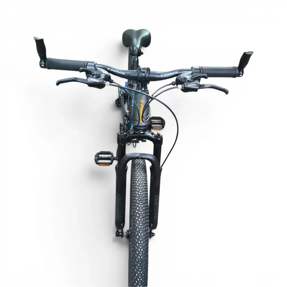Front view of Trinx K024 24-Inch Mountain Bike showing handlebars, front suspension fork, and Kenda tire on a white background
