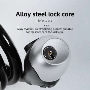 Close-up of a silver alloy steel lock core cylinder with text reading "Alloy steel lock core" on a light gray background.