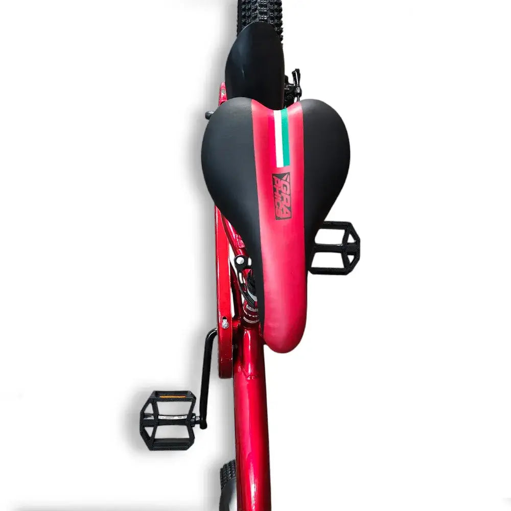 Top-down view of the comfortable black saddle and pedals on RF 20-inch kids bike.