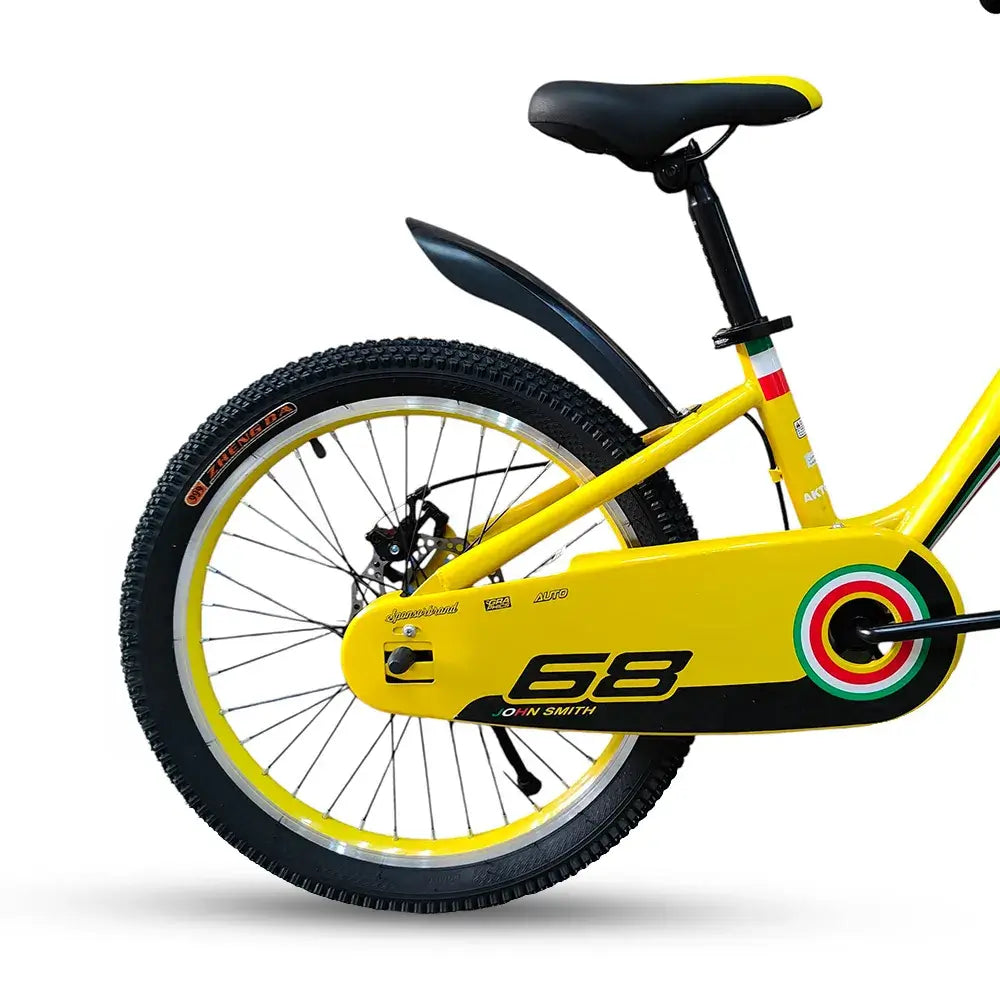 Close-up of rear wheel, yellow chain guard with 68 graphic, and black rear fender on RF 20-inch kids bike.