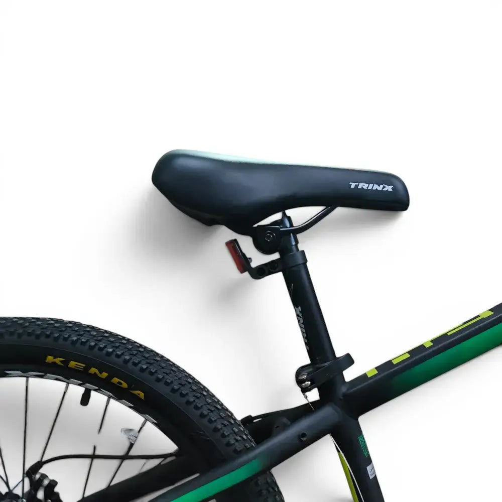 Close-up of comfortable Trinx mountain bike saddle and rear frame on Trinx K024 24-inch green bike