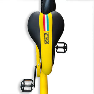 Top-down view of the yellow and black saddle and pedals on RF 20-inch kids bike.