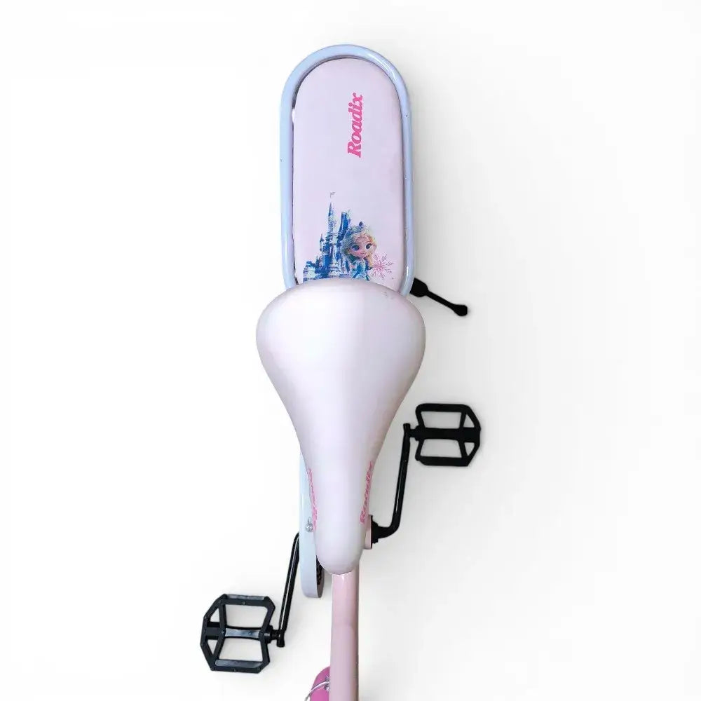 Close-up top view of the adjustable pink saddle and padded rear seat of a Roadix girls bicycle.
