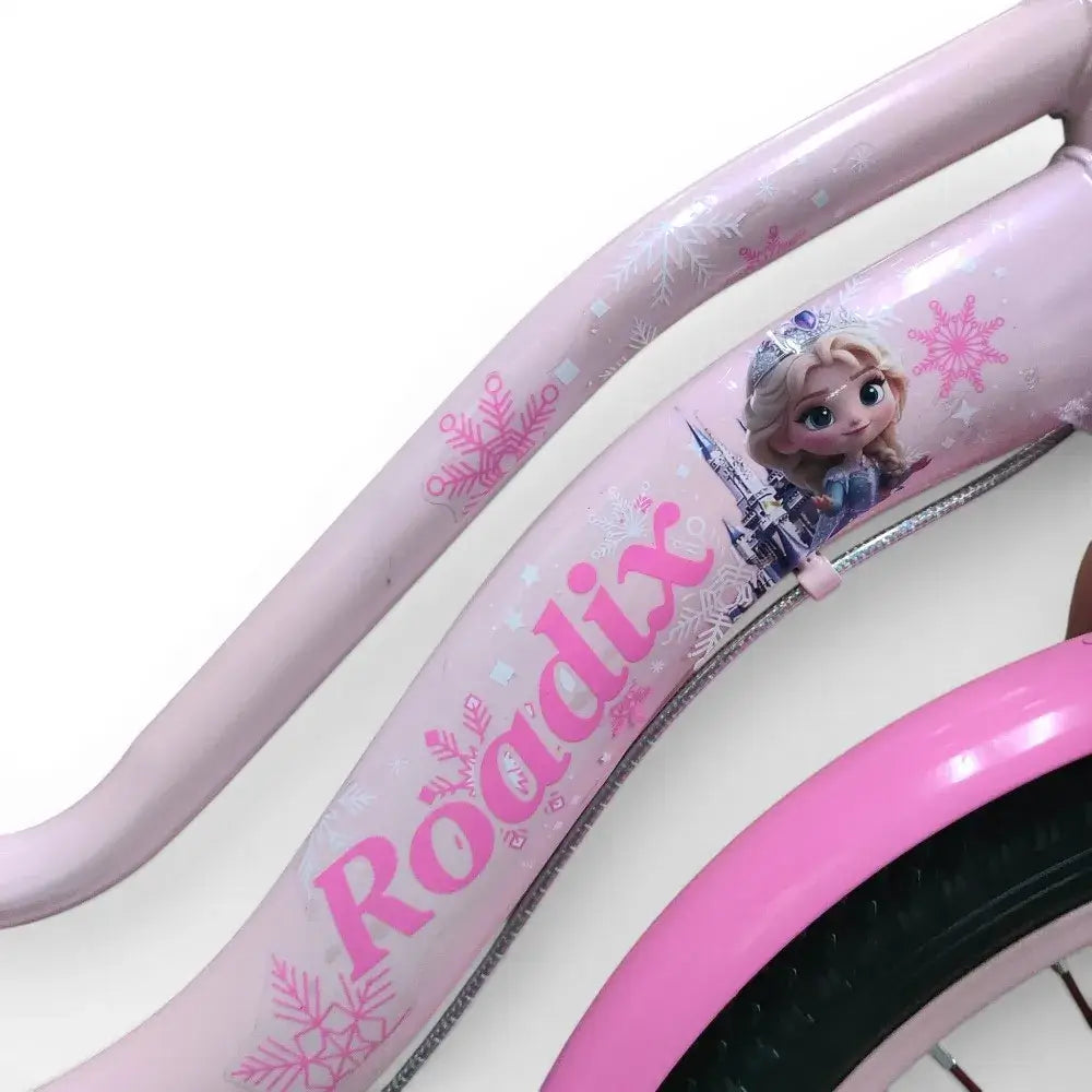 Close-up side view of the pink steel frame with Roadix branding and Frozen graphics of a girls bicycle.
