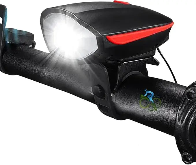 Black bicycle headlight with red trim and illuminated front LED beam, mounted on a bicycle handlebar.
