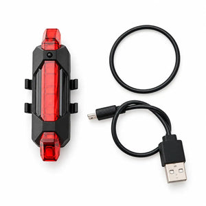Red rechargeable bicycle tail light with mounting band and USB charging cable
