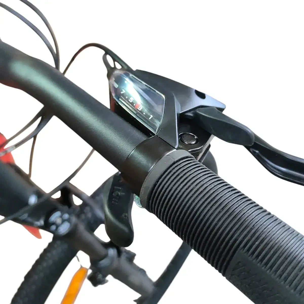 Close-up of Trinx 007 PRO mountain bike handlebar showing textured rubber grip, Shimano gear shifter, and brake lever.