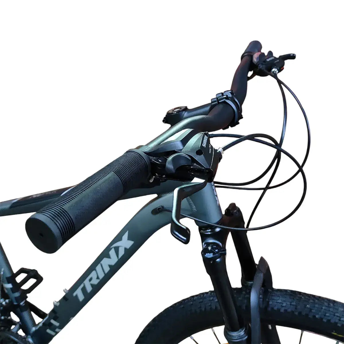 Close-up of Trinx M007 PRO mountain bike frame and handlebars, showing black grips, brake levers, cables, front suspension fork, and Trinx logo on the gray frame.