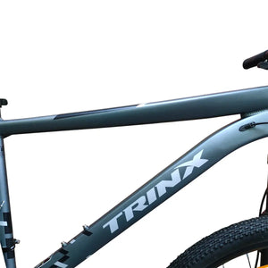 Close-up of Trinx M007 PRO aluminum mountain bike frame, featuring matte dark gray finish with a bold white Trinx logo on the down tube.