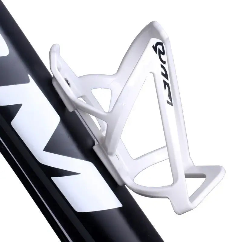White bicycle water bottle cage mounted on a black bike frame