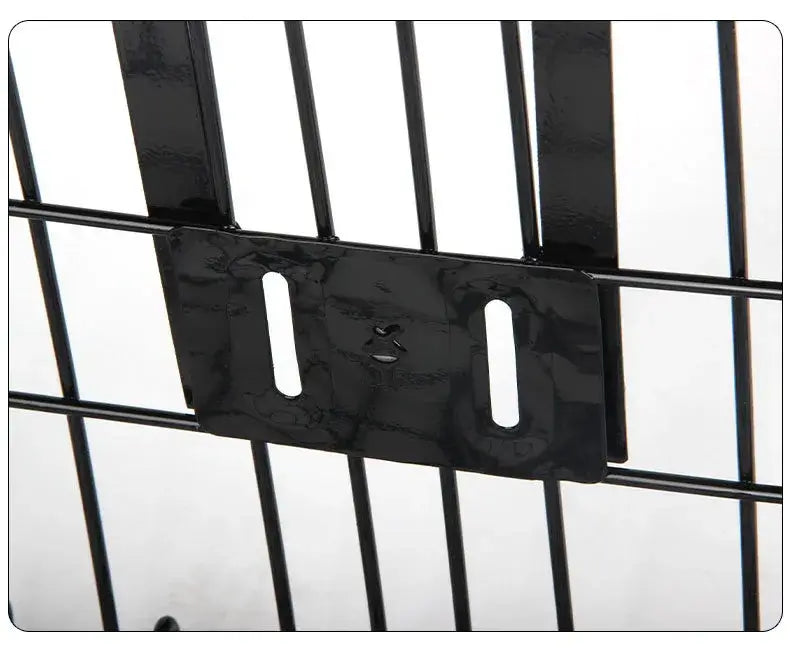 Close-up view of the metal mounting bracket on a black wire bicycle basket