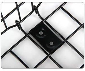Close-up product photograph focusing on the reinforced metal mounting plate with two screw holes on the black wire grid of a bicycle basket, on a plain white background