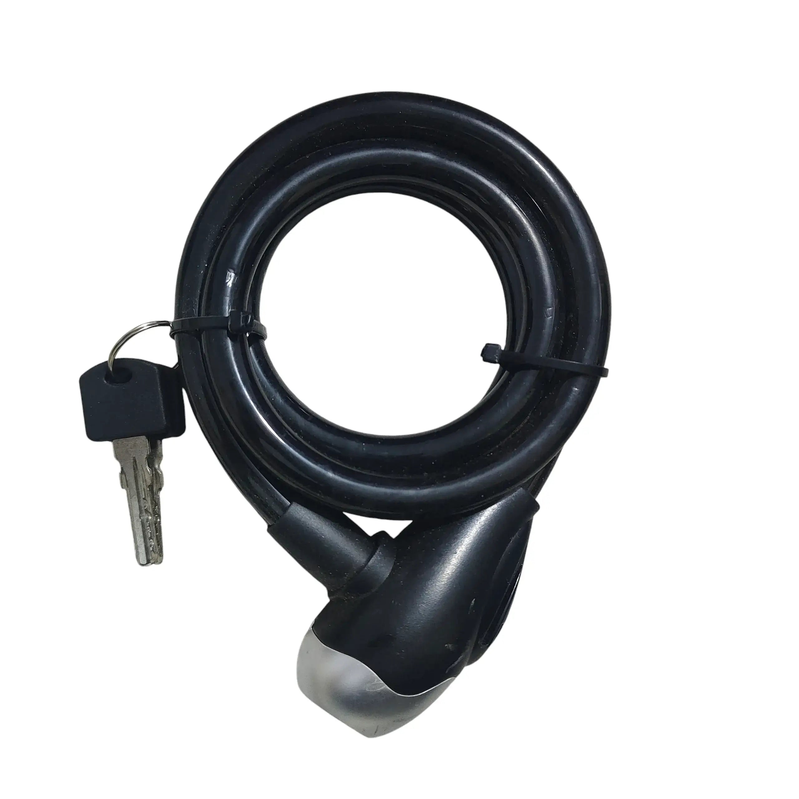 Coiled black flexible bicycle cable lock with key inserted into the locking head, isolated on a white background.