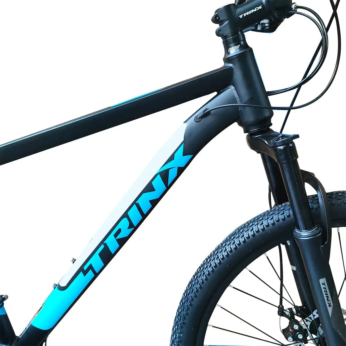 Close-up view of Trinx K026 mountain bike frame with blue branding and front suspension fork, isolated on white background