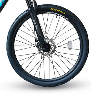 Close-up view of Trinx K026 front wheel featuring Kenda tire and mechanical disc brake assembly, isolated on white background