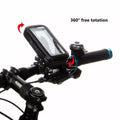 Black waterproof bike phone mount installed on handlebars with red arrows showing 360-degree rotation